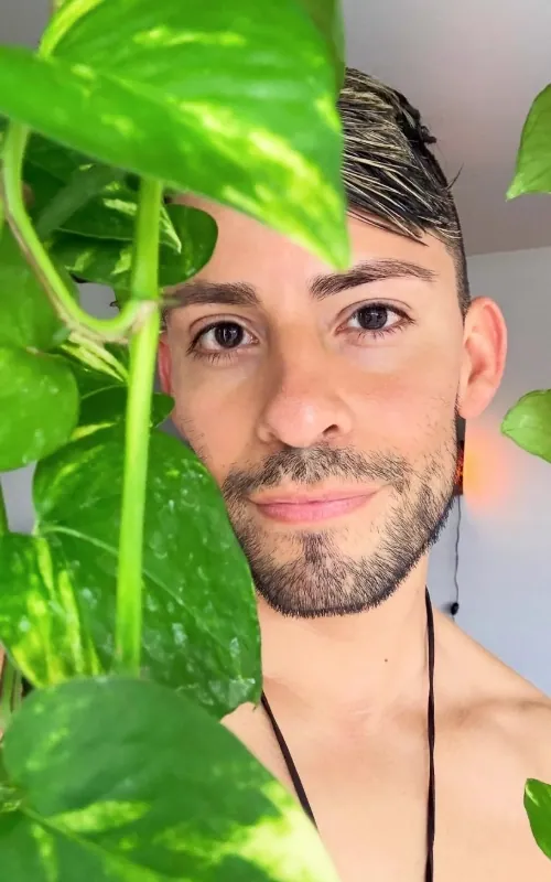 Michael holding a large green leaf